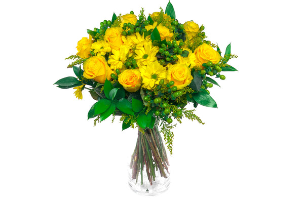 Yellow Delight. A hand Tie Bouquet Beautifuly wrapped and Deliver in a clear glass vase.